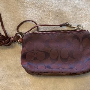 Small Maroon Coach Wristlet in fair condition